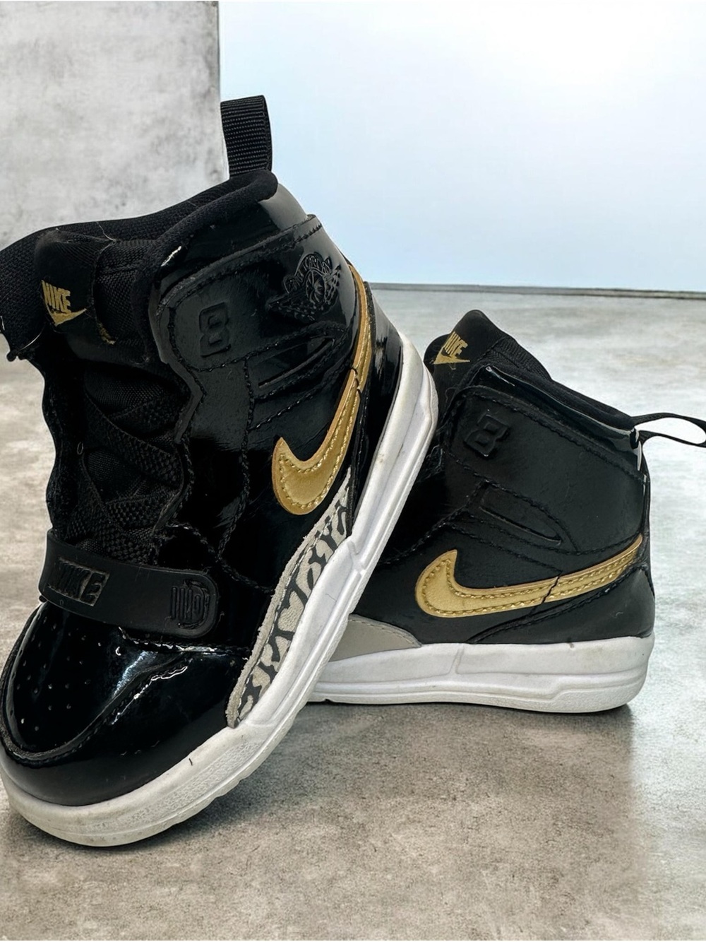 Jordan Kids Black and Gold High-Top Sneakers